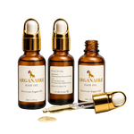 Arganaire Pure Moroccan Argan Oil bottle with gold dropper against a light background