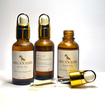 Three authentic 30 ml Arganaire bottles showing front and ingredient labels with an open glass dropper and golden argan oil